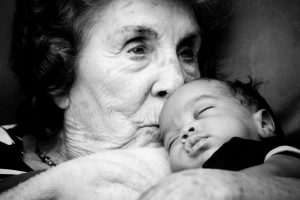 Great Grandma holding a Baby Boy