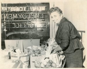 Preparing food baskets for the hungry at her Employment Office in Milwaukee