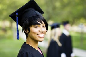 Young Woman Profile in Graduation Gown